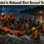 Fire services personnel rescuing 12 stranded people from the Mahanadi River near Sidhmala in Nayagarh
